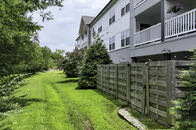 a backyard of a house with lots of green space