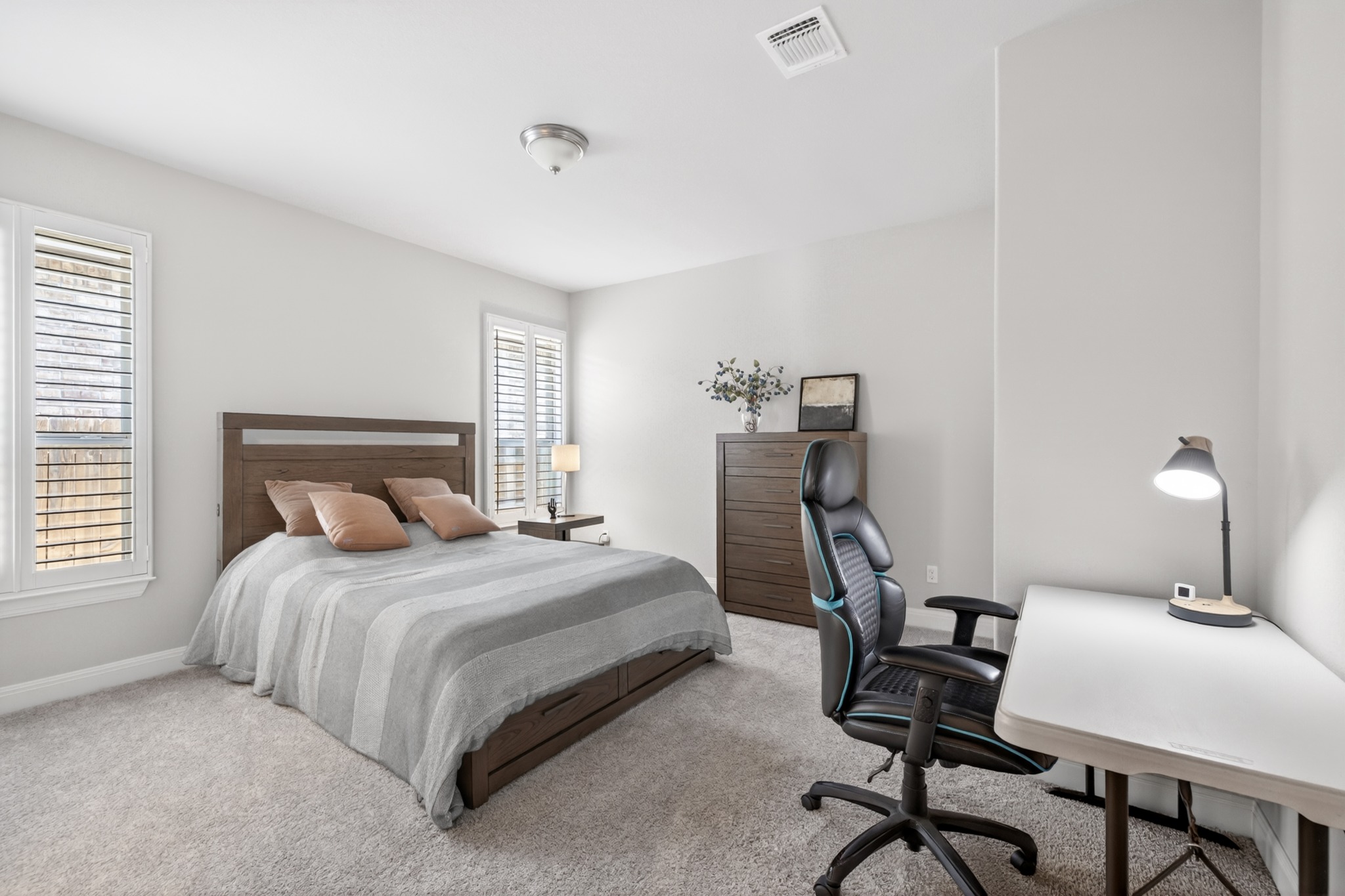 4105 Haight Street Round Rock, TX 78681 - Photo 26 of 40 a bedroom with a bed a desk and chair