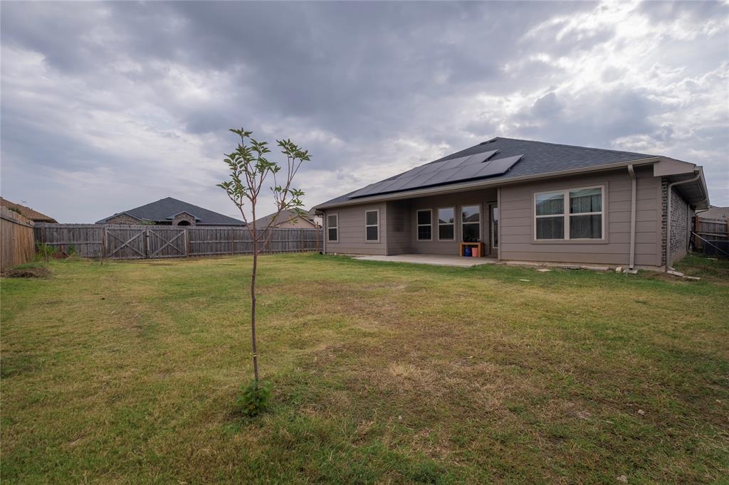 106 Spring Crest Street Mabank, TX 75147 - Photo 22 of 22 a front view of a house with garden
