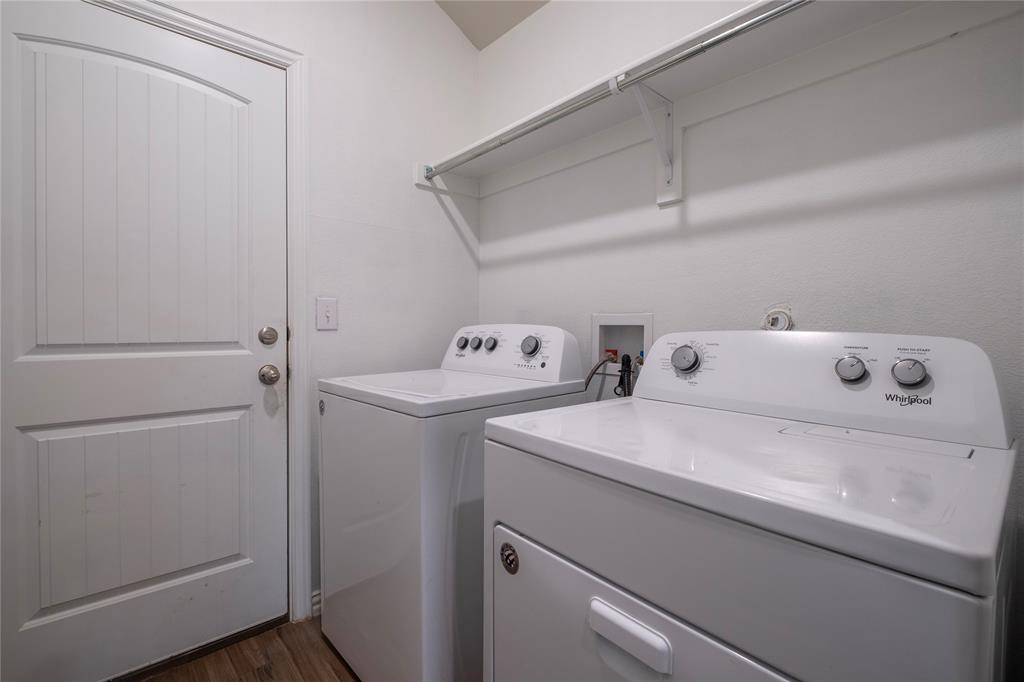 106 Spring Crest Street Mabank, TX 75147 - Photo 9 of 22 a utility room with dryer and washer
