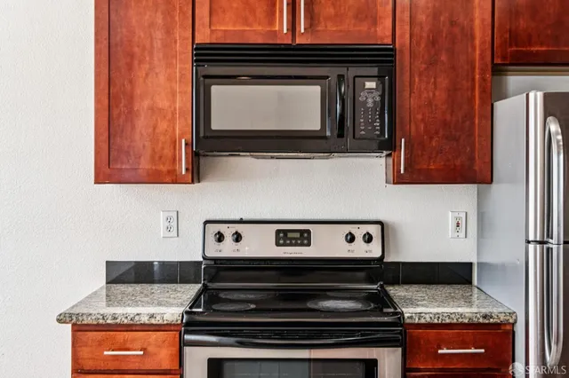 a kitchen with a stove and a microwave