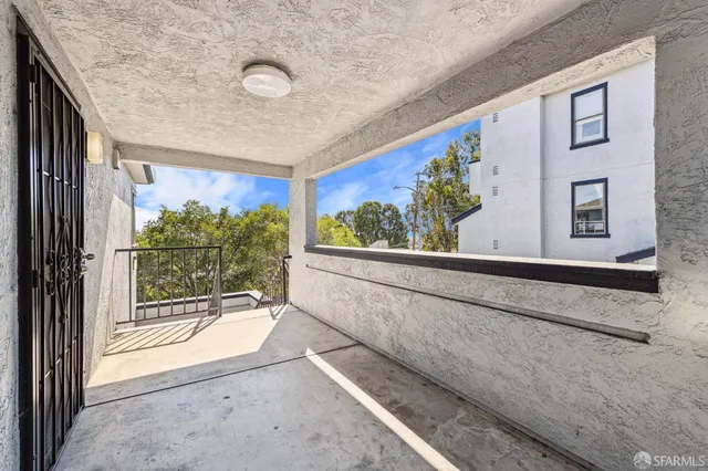 a view of a door and wooden floor