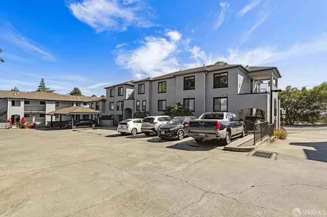 a view of a cars park in front of house
