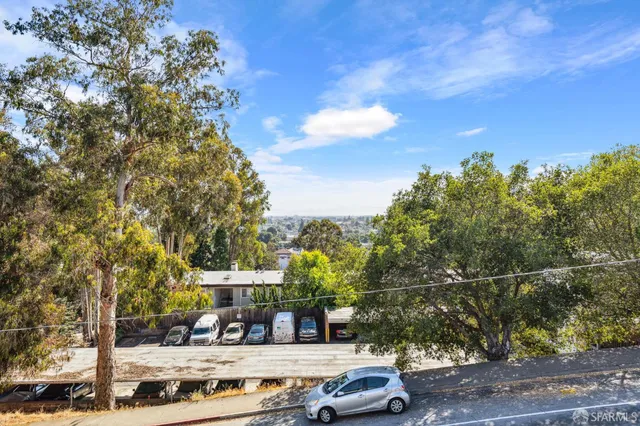 a view of street with parked cars