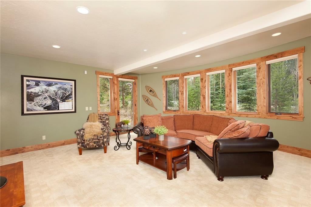 10 Wolf Rock Road Keystone, CO 80435 - Photo 15 of 25 a living room with furniture and large windows