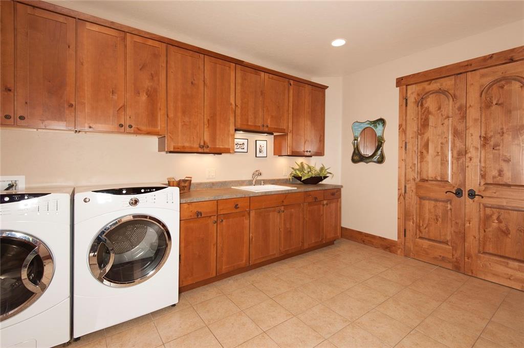 10 Wolf Rock Road Keystone, CO 80435 - Photo 24 of 25 a kitchen with a refrigerator sink and cabinets