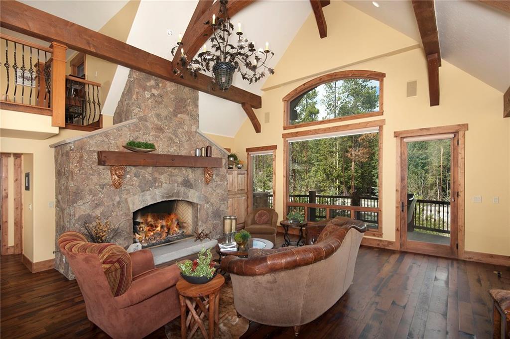 10 Wolf Rock Road Keystone, CO 80435 - Photo 5 of 25 a living room with furniture a fireplace and a large window