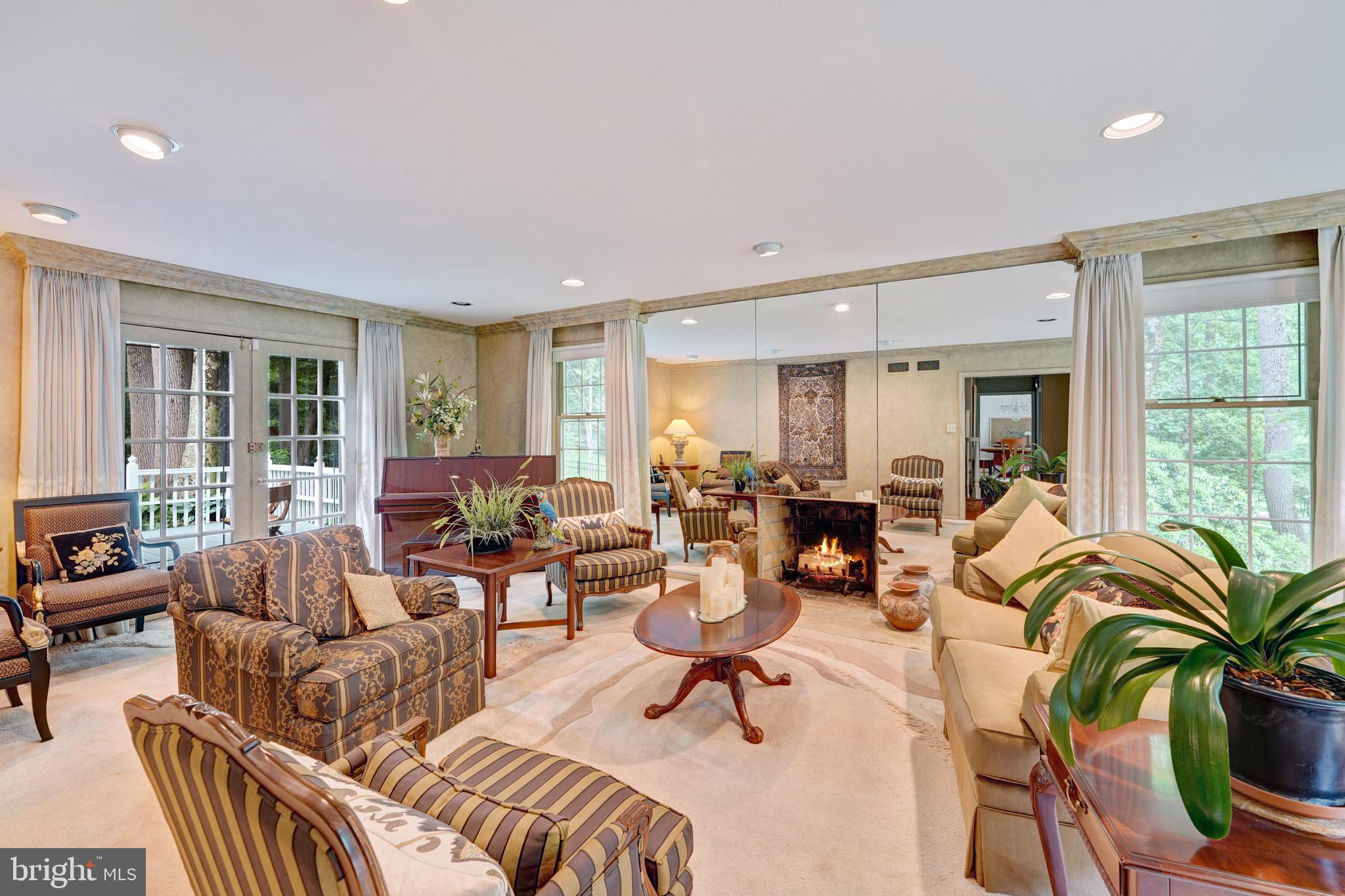741 Campwoods Road Villanova, PA 19085 - Photo 12 of 48 a living room with furniture potted plant and a large window