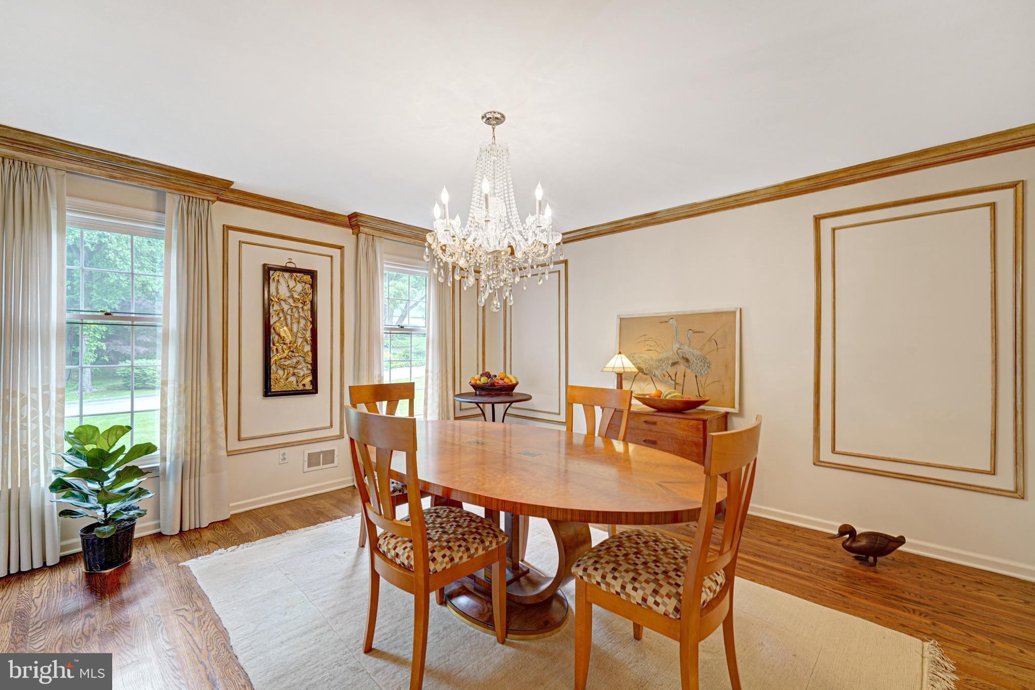 741 Campwoods Road Villanova, PA 19085 - Photo 15 of 48 a dining room with furniture potted plants and wooden floor