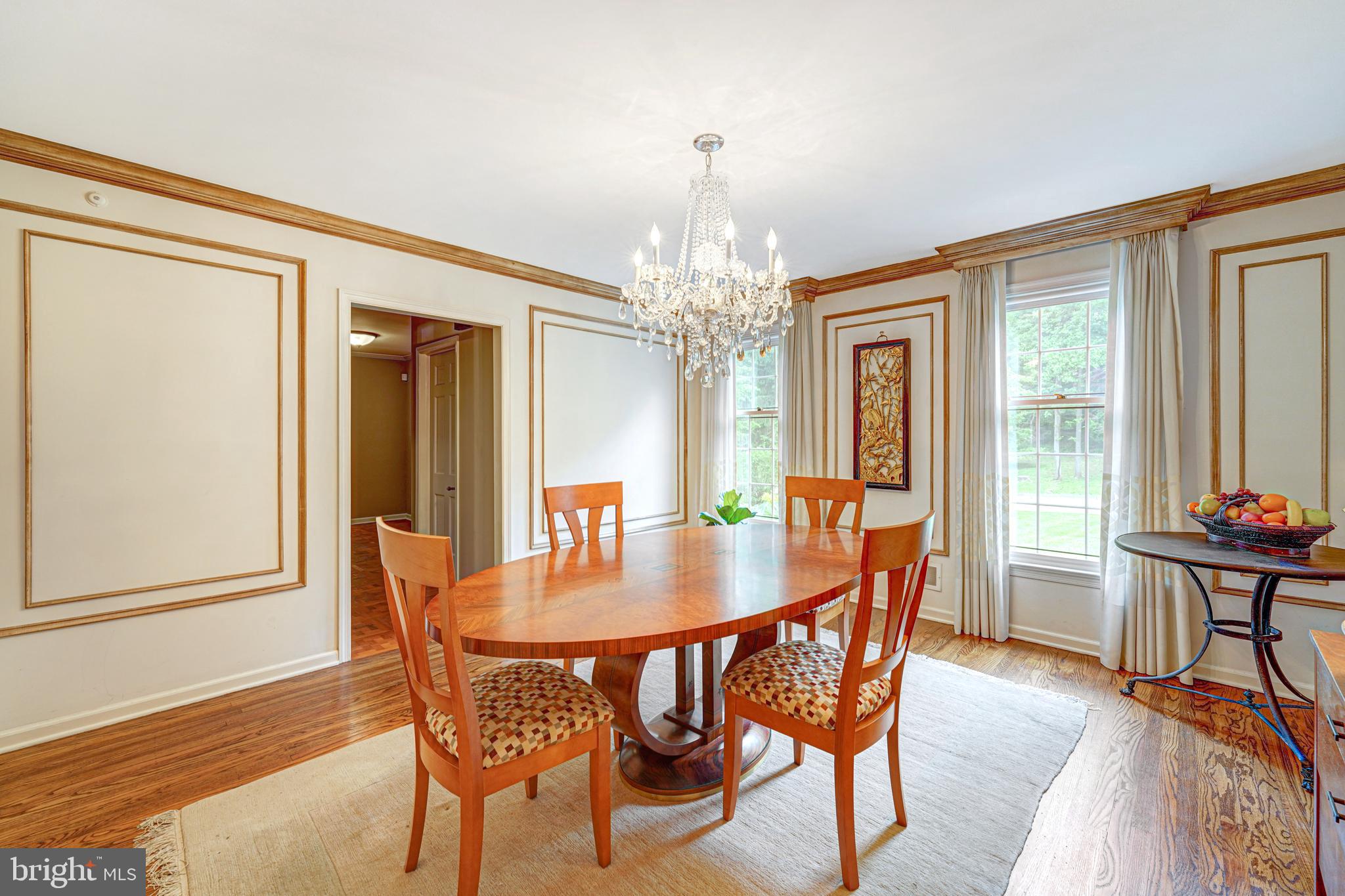 741 Campwoods Road Villanova, PA 19085 - Photo 16 of 48 a dining room with furniture a chandelier and wooden floor