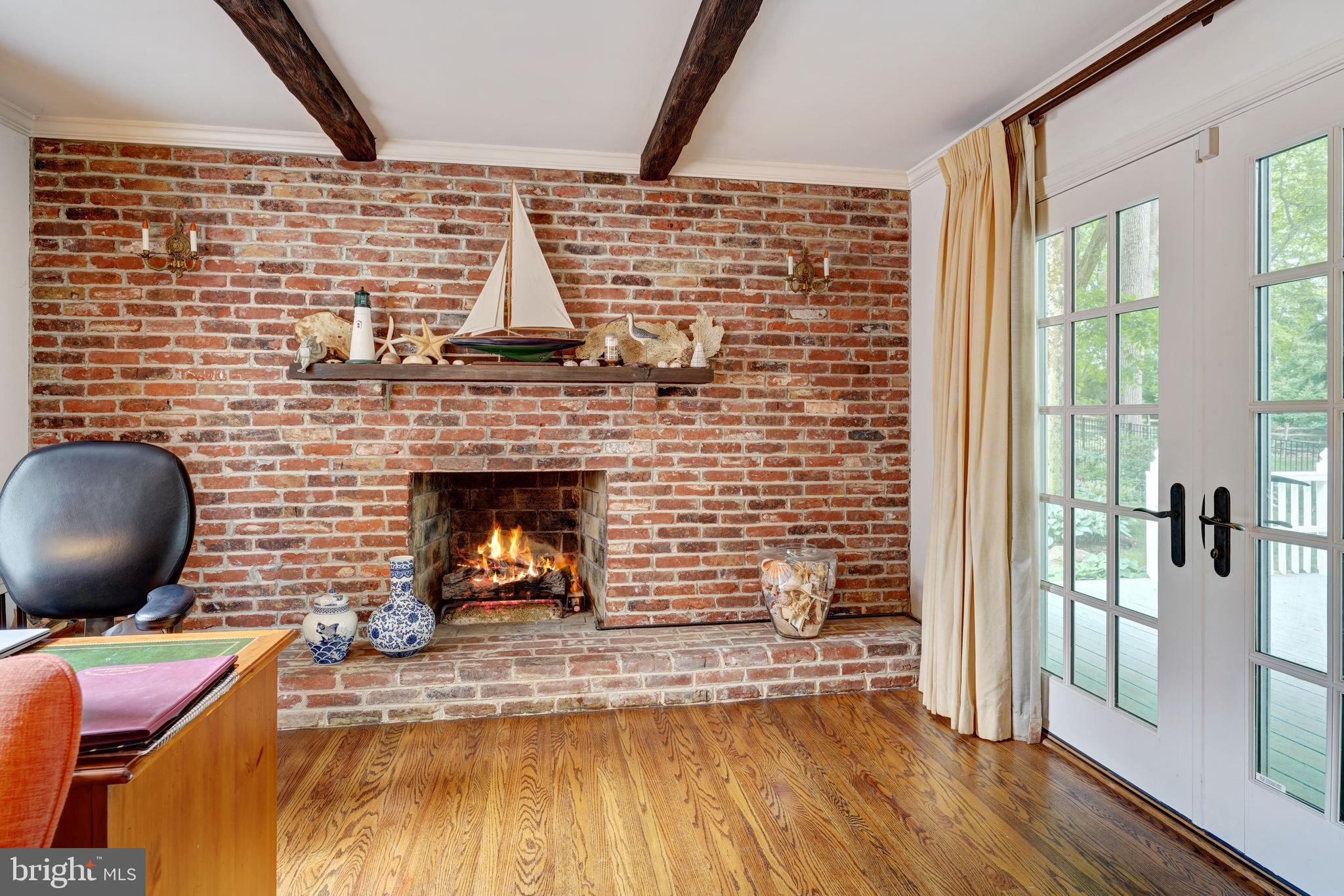 741 Campwoods Road Villanova, PA 19085 - Photo 23 of 48 a living room with furniture and a fireplace