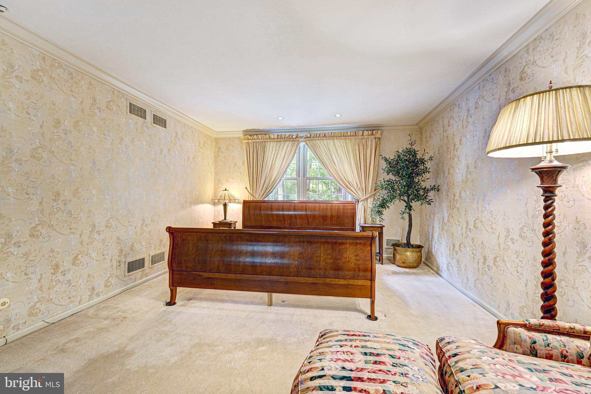 741 Campwoods Road Villanova, PA 19085 - Photo 29 of 48 a living room with a couch and a potted plant