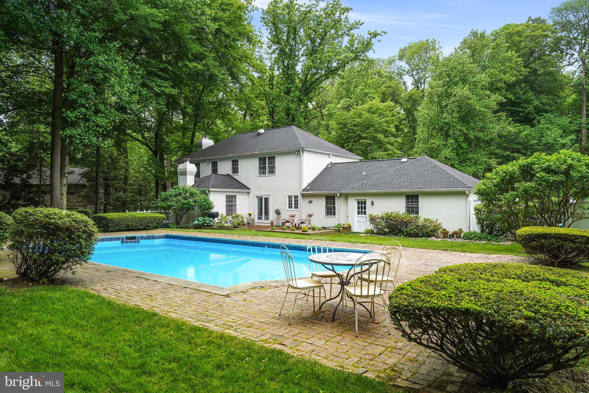 741 Campwoods Road Villanova, PA 19085 - Photo 4 of 48 a view of a house with swimming pool and sitting area