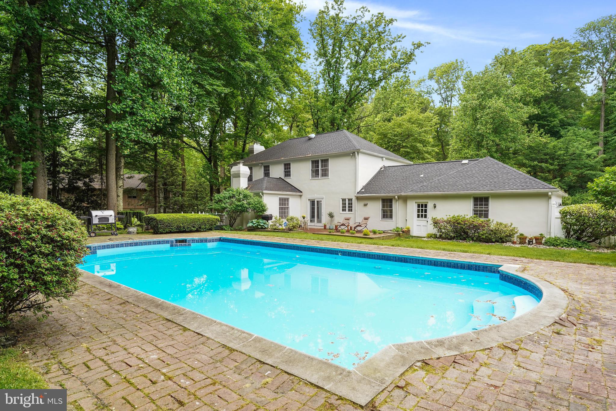 741 Campwoods Road Villanova, PA 19085 - Photo 44 of 48 a front view of house and swimming pool with yard