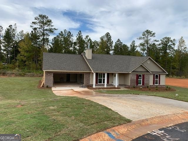 front view of a house with a yard