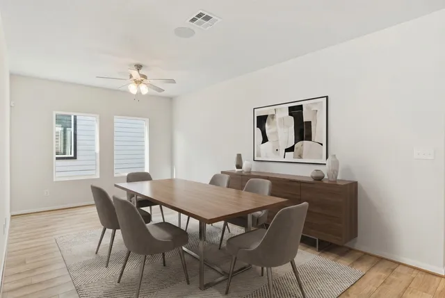 a view of a dining room with furniture and window