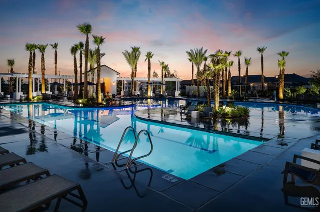 a group of people sitting in front of retail shop