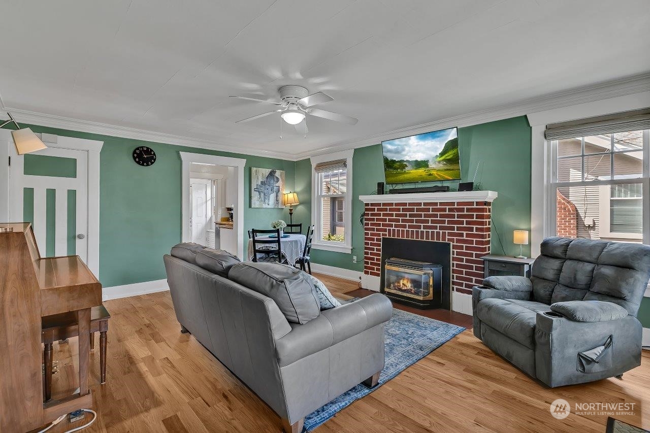 1207 North 2nd Street Renton, WA 98057 - Photo 3 of 20 a living room with furniture and a fireplace