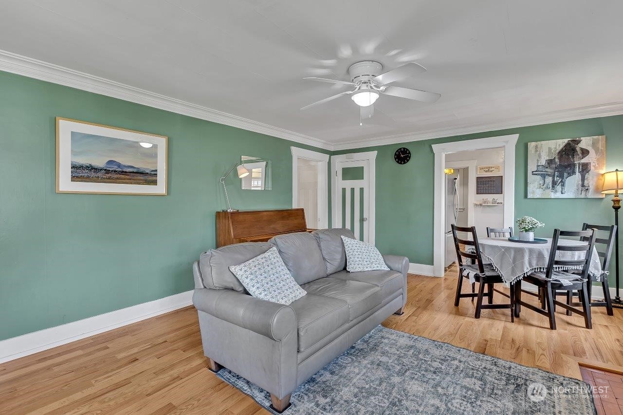 1207 North 2nd Street Renton, WA 98057 - Photo 5 of 20 a living room with furniture and wooden floor
