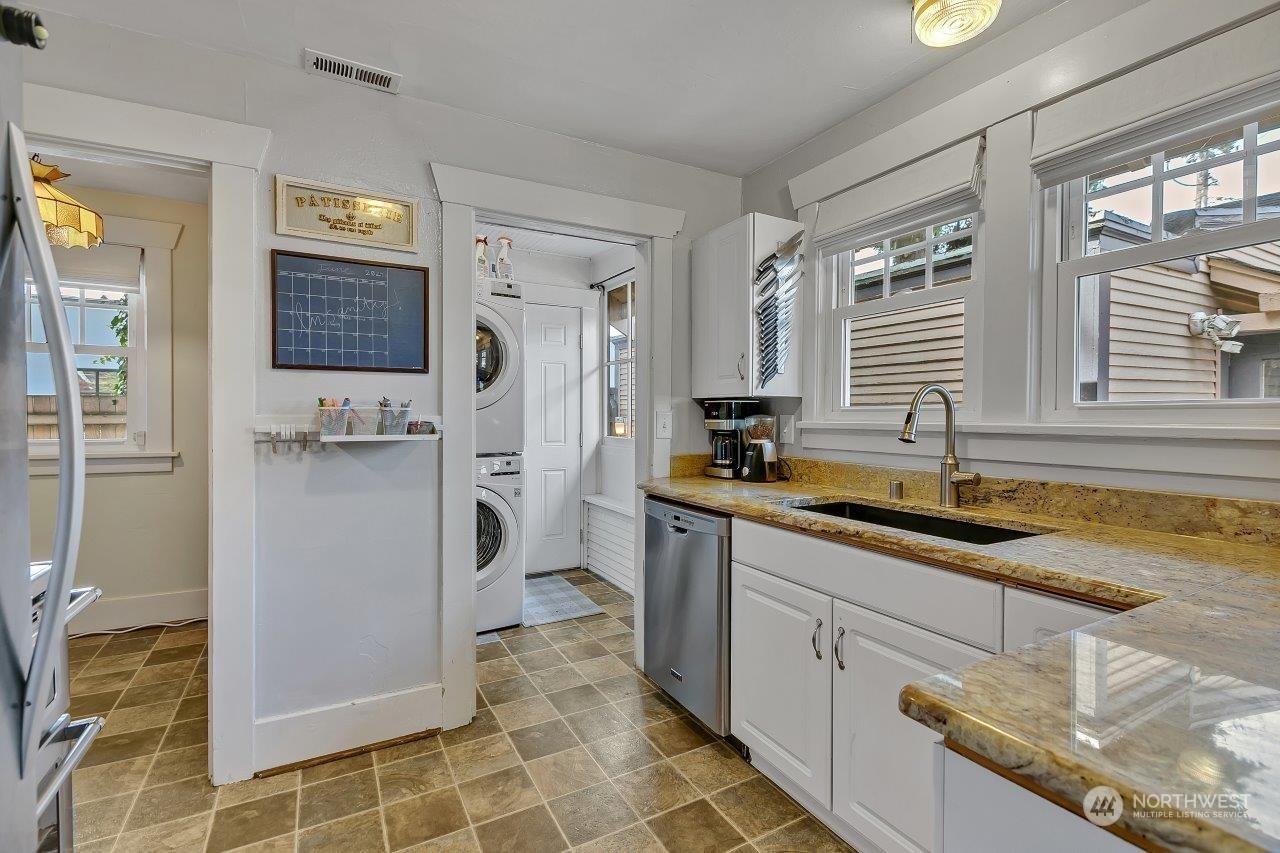 1207 North 2nd Street Renton, WA 98057 - Photo 8 of 20 a kitchen with a sink and cabinets