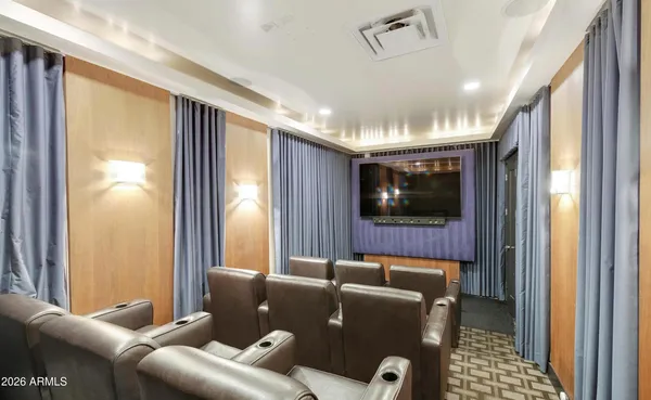 a room with pool table and windows