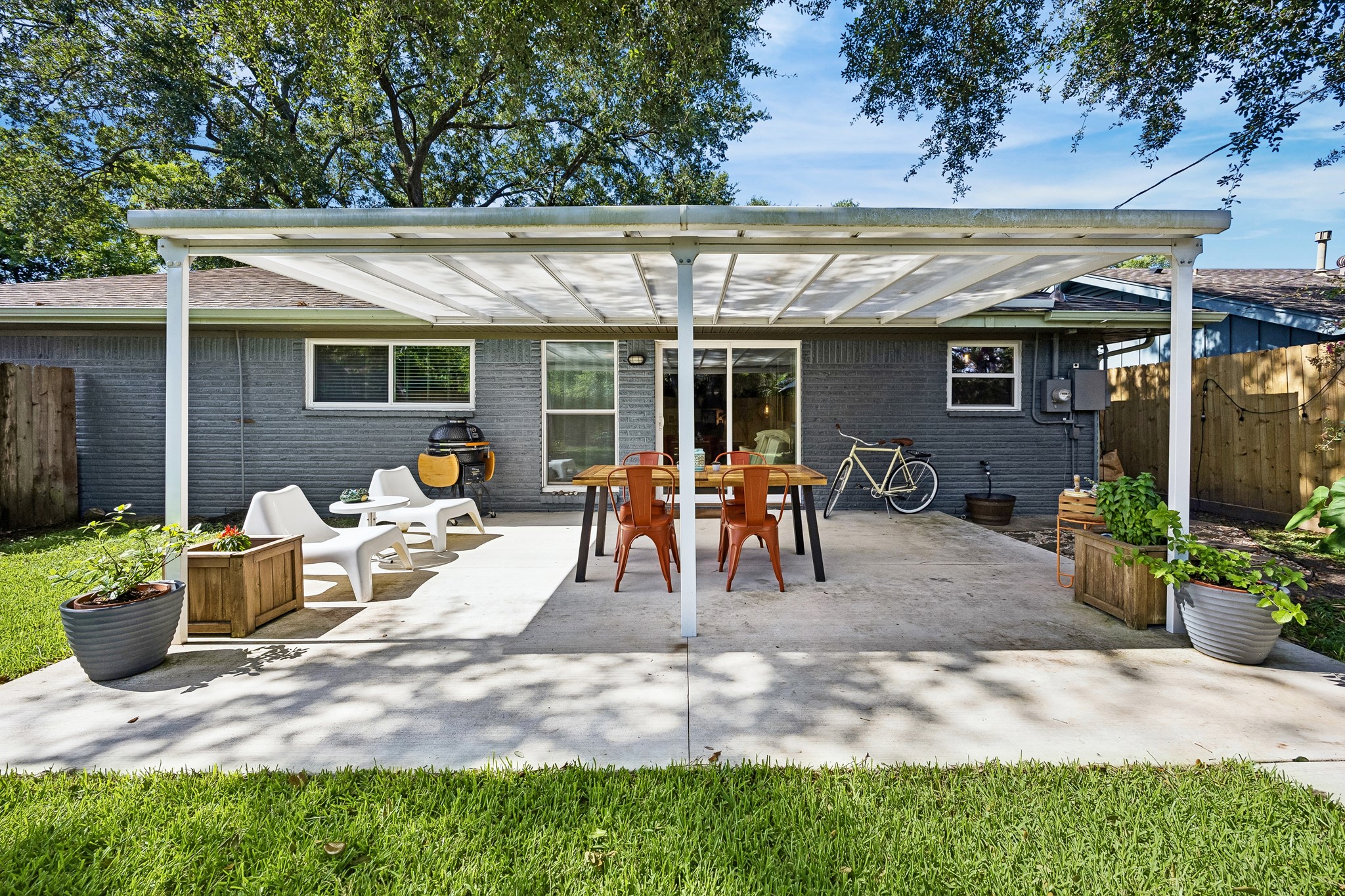 4514 Warm Springs Road Houston, TX 77035 - Photo 26 of 31 The covered patio is large enough for outdoor dining, grilling and lounging. This inviting space is ideal for entertaining and creating memories.