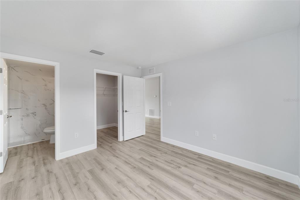 3467 Southwest 150th Court Ocala, FL 34481 - Photo 20 of 35 a view of an empty room with wooden floor and closet