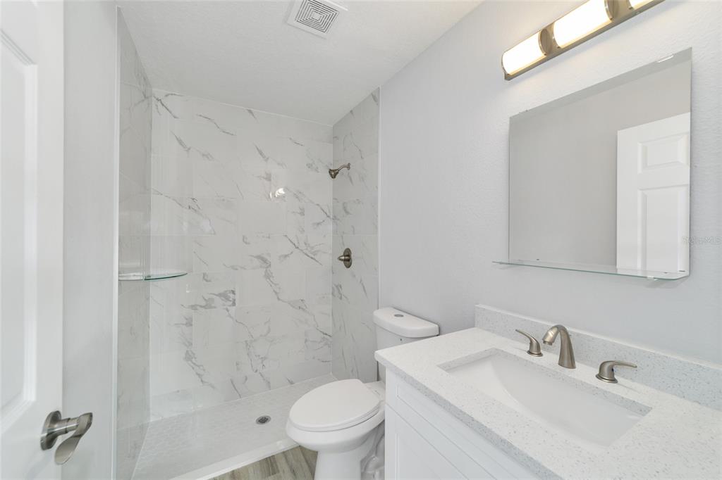 3467 Southwest 150th Court Ocala, FL 34481 - Photo 23 of 35 a bathroom with a sink toilet and shower