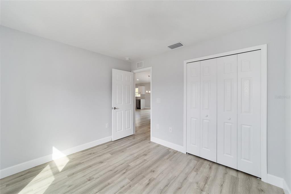 3467 Southwest 150th Court Ocala, FL 34481 - Photo 30 of 35 a view of wooden floor and windows in a room