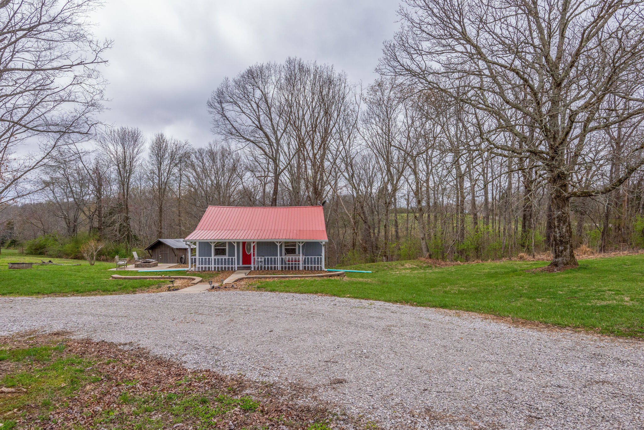 7606 Pewitt Road Franklin, TN 37064 - Photo 2 of 28 a sign board with a big yard and large trees