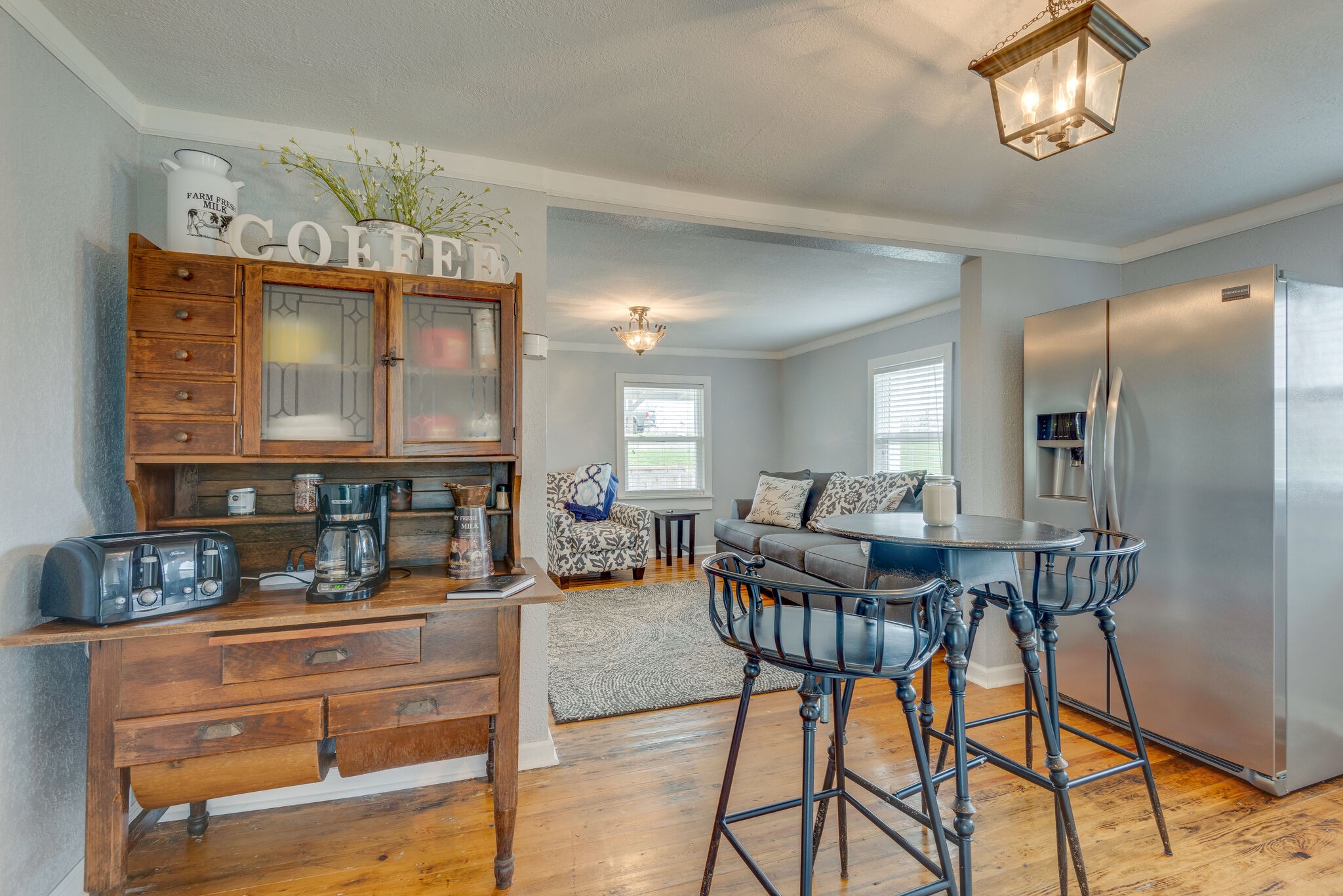 7606 Pewitt Road Franklin, TN 37064 - Photo 13 of 28 a living room with fireplace furniture and a chandelier
