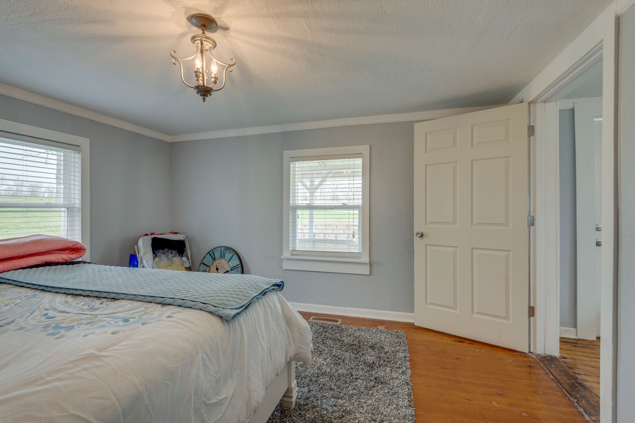 7606 Pewitt Road Franklin, TN 37064 - Photo 18 of 28 a bedroom with a bed and a chandelier