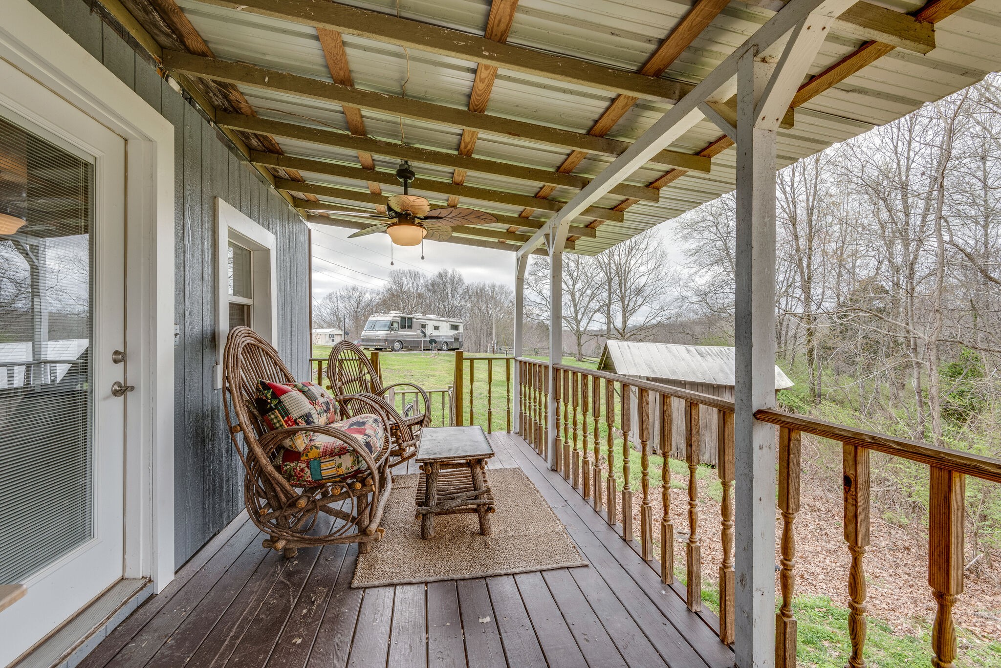 7606 Pewitt Road Franklin, TN 37064 - Photo 21 of 28 a view of a balcony with chairs and wooden floor