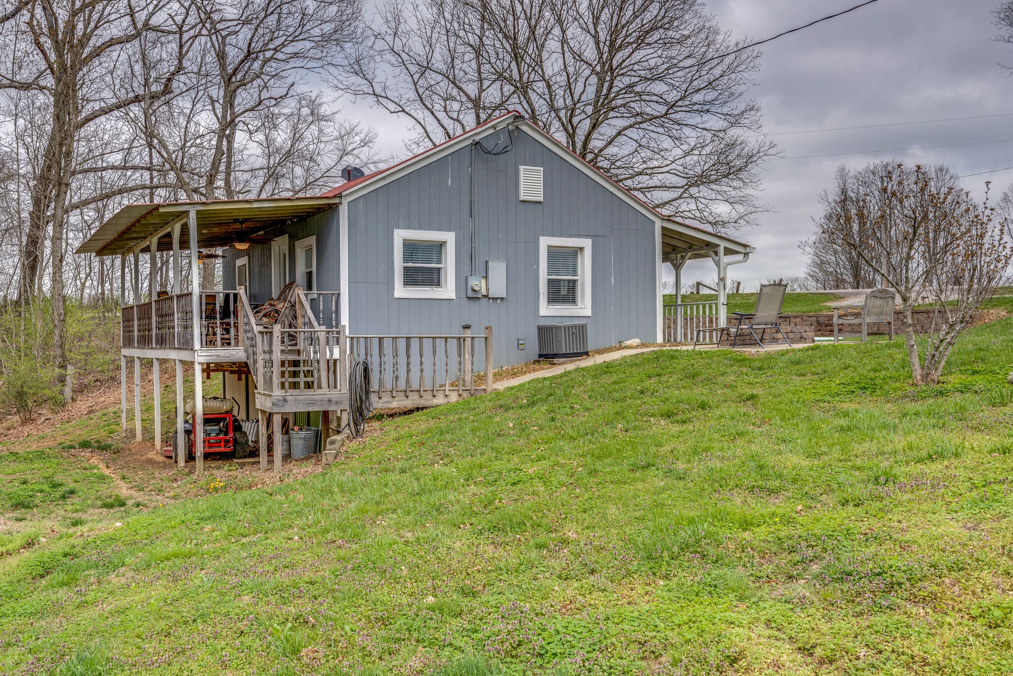 7606 Pewitt Road Franklin, TN 37064 - Photo 24 of 28 a front view of a house with a yard table and chairs