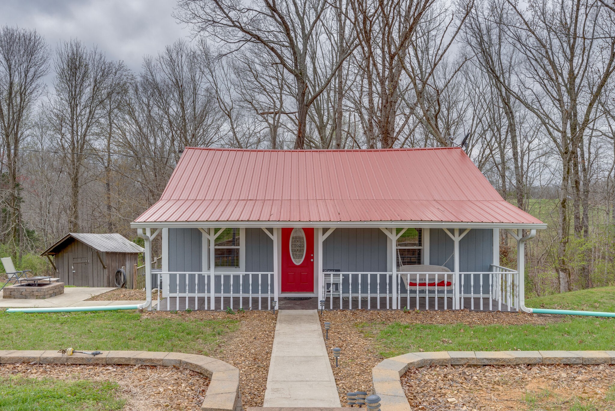 7606 Pewitt Road Franklin, TN 37064 - Photo 4 of 28 a front view of a house with a garden
