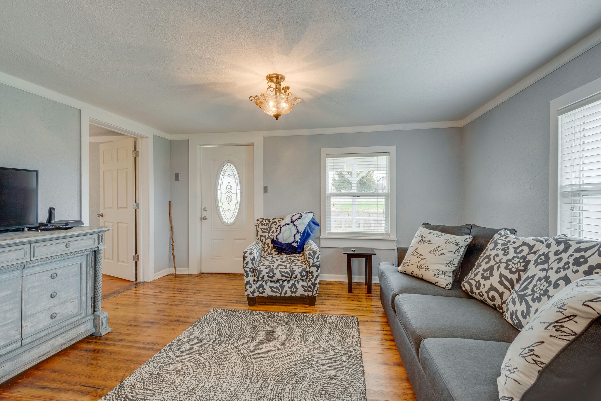 7606 Pewitt Road Franklin, TN 37064 - Photo 6 of 28 a living room with furniture and a flat screen tv
