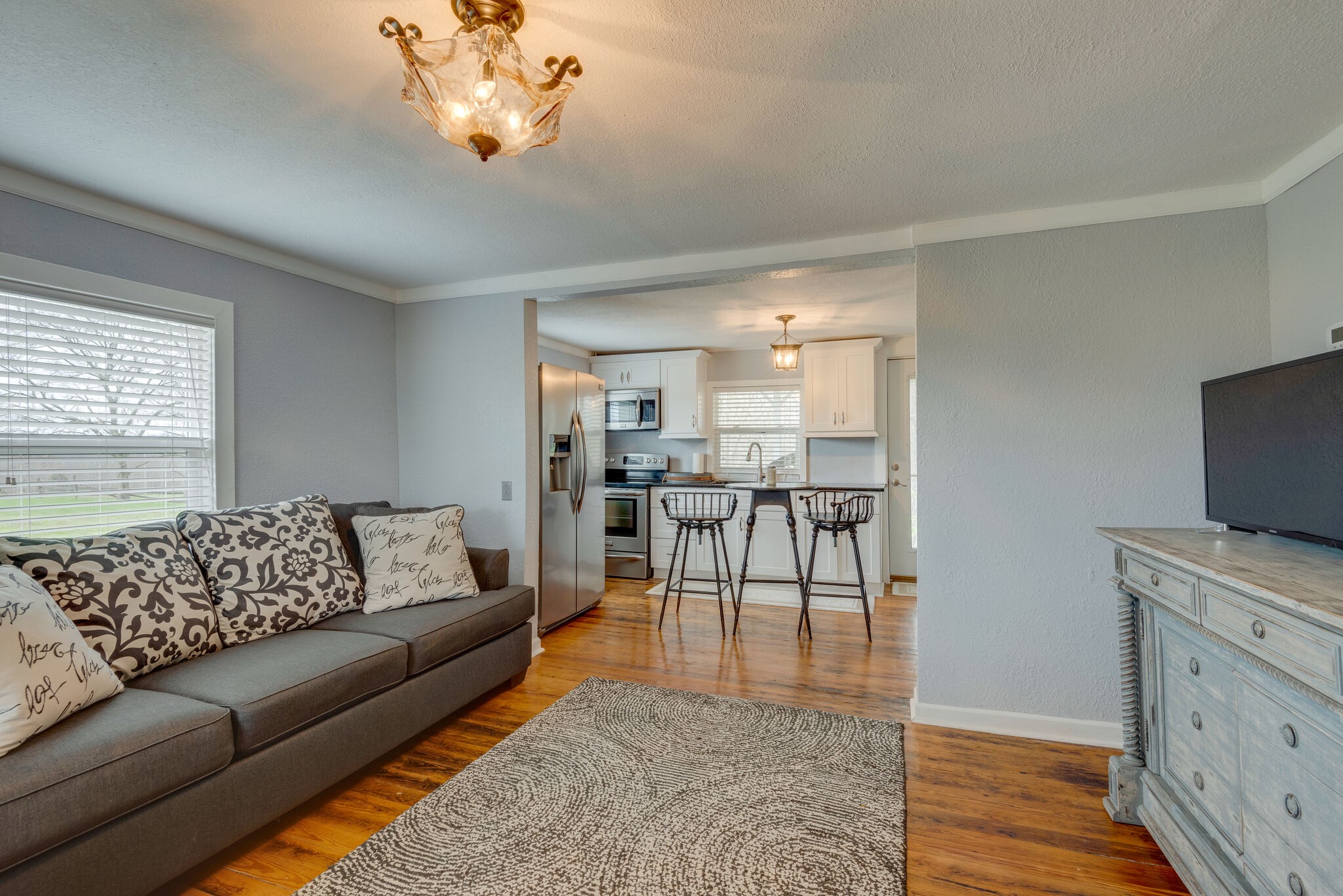 7606 Pewitt Road Franklin, TN 37064 - Photo 8 of 28 a living room with furniture and a flat screen tv