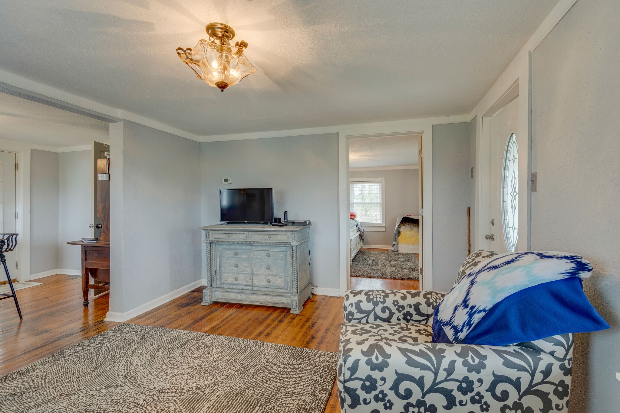7606 Pewitt Road Franklin, TN 37064 - Photo 9 of 28 a bedroom with a bed and a chandelier
