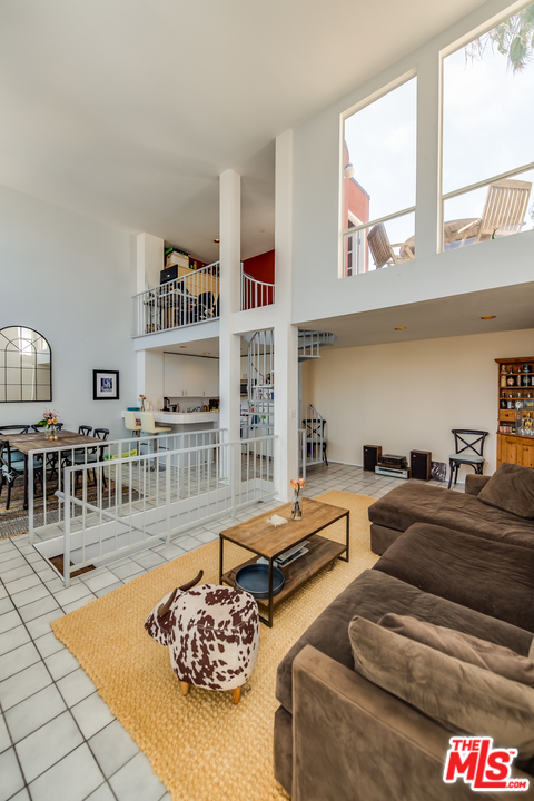114 Fleet Street Marina del Rey, CA 90292 - Photo 1 of 19 a living room with furniture and a large window