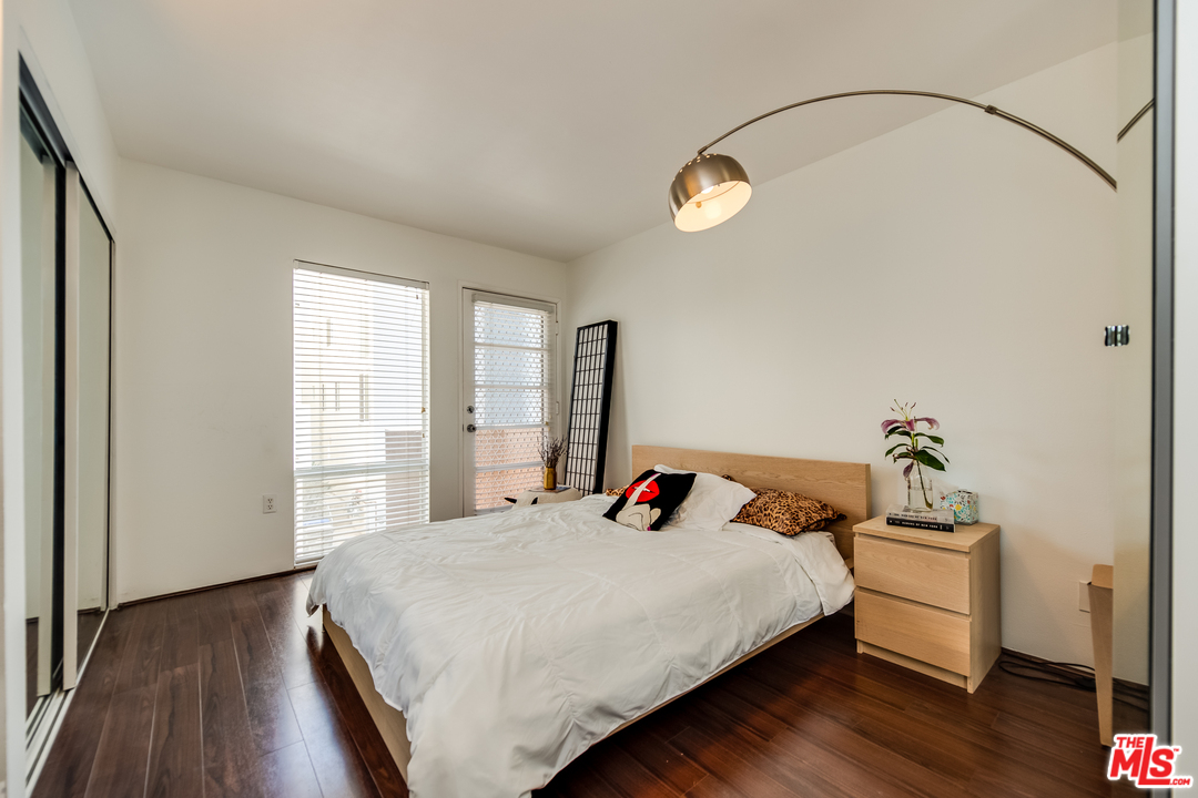114 Fleet Street Marina del Rey, CA 90292 - Photo 11 of 19 a bedroom with a bed and wooden floor