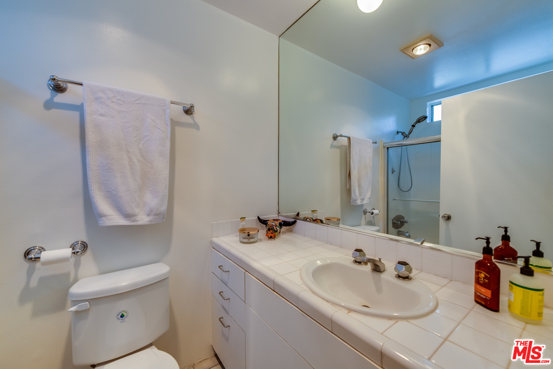 114 Fleet Street Marina del Rey, CA 90292 - Photo 14 of 19 a bathroom with a sink double vanity and a mirror