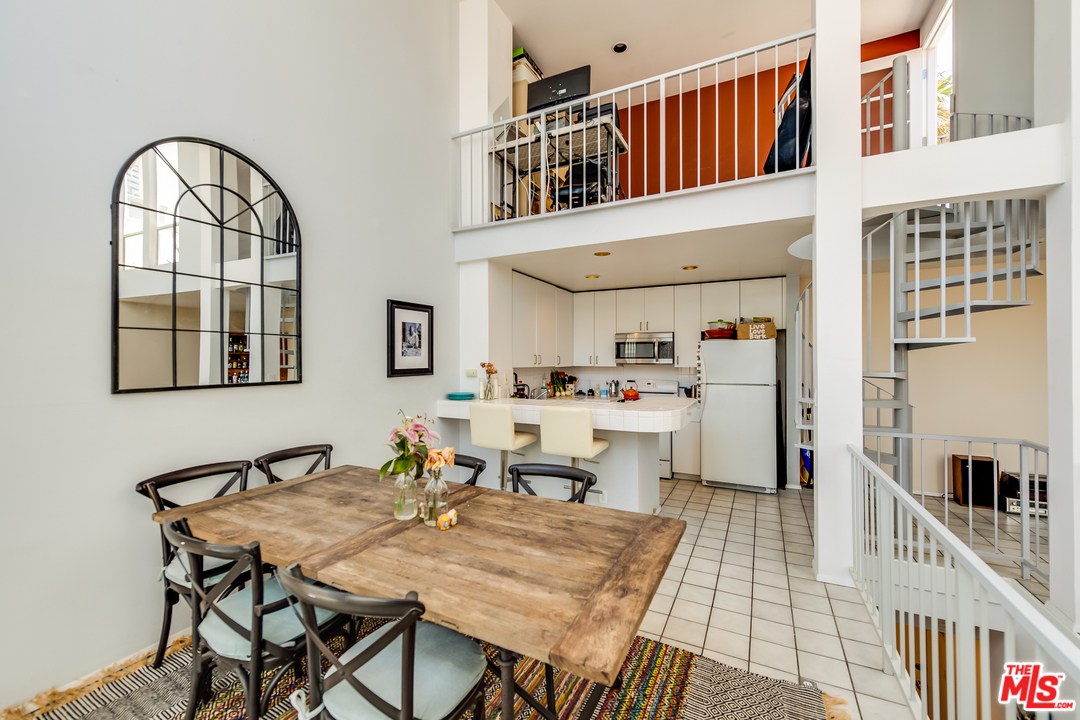 114 Fleet Street Marina del Rey, CA 90292 - Photo 7 of 19 a living room with stainless steel appliances kitchen island granite countertop furniture and a kitchen view