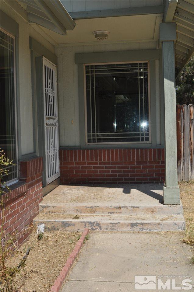 5385 Ladybug Court Reno, NV 89523 - Photo 1 of 1 a view of porch with a door and a window