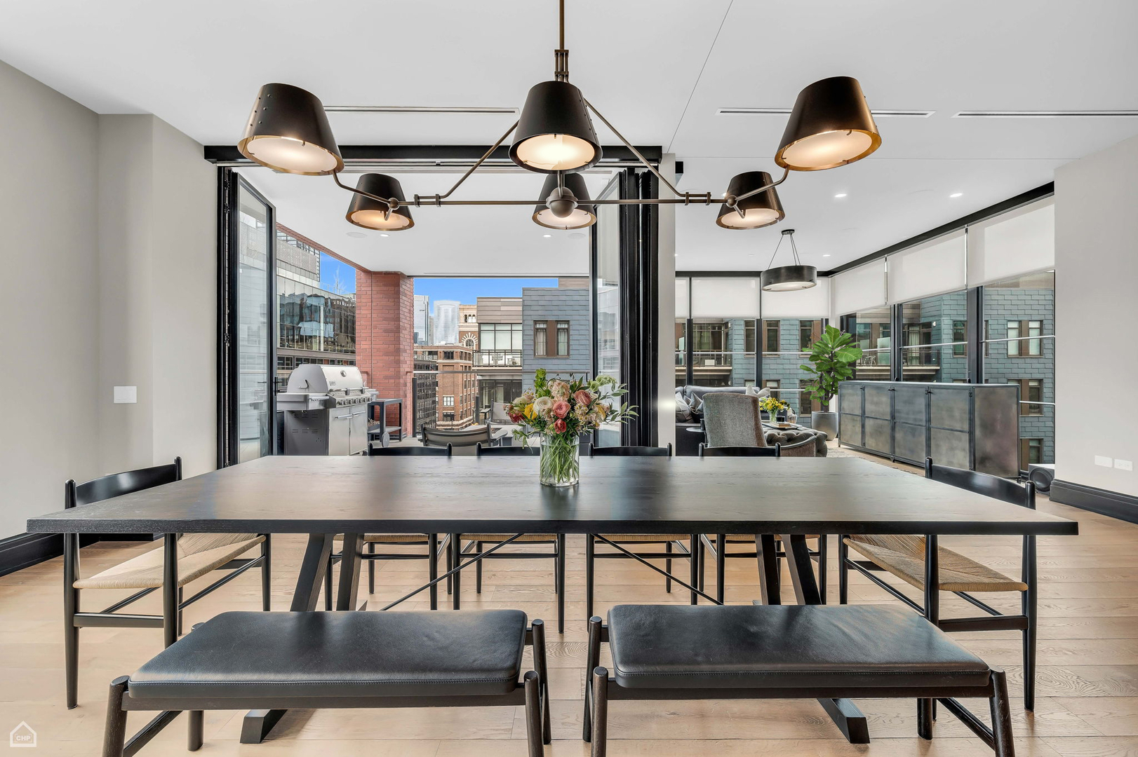 1109 West Washington Boulevard, Unit 6B Chicago, IL 60607 - Photo 18 of 40 a view of a dining room with furniture and chandelier