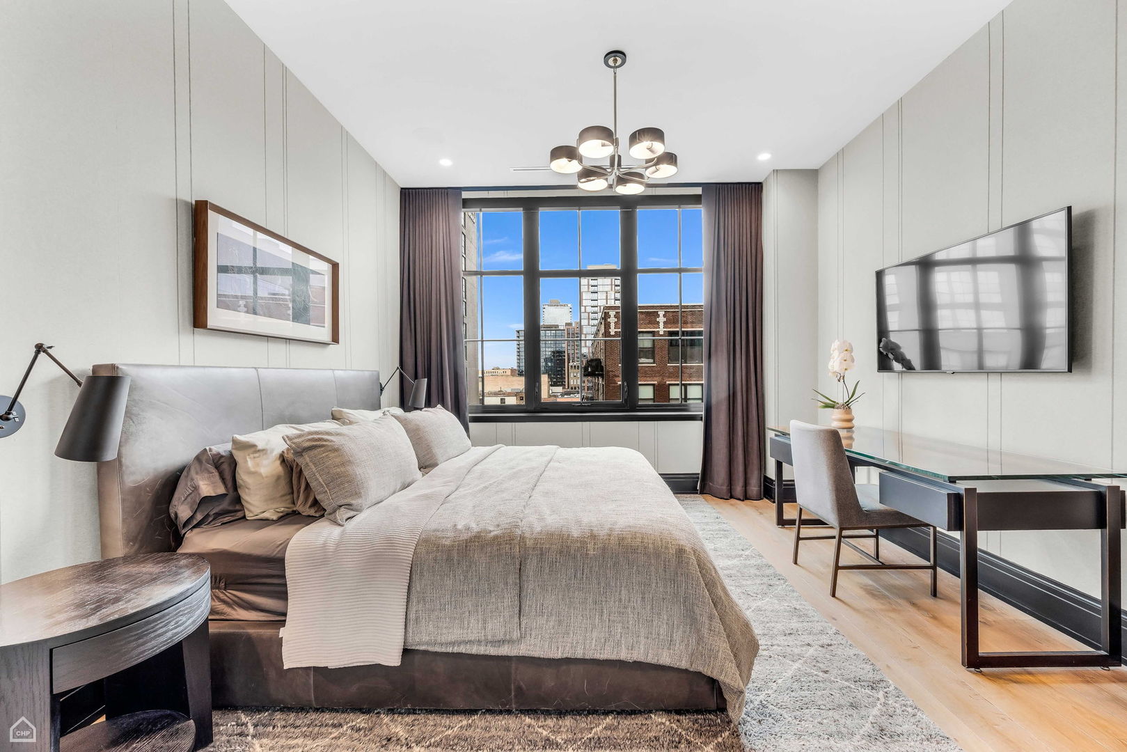 1109 West Washington Boulevard, Unit 6B Chicago, IL 60607 - Photo 23 of 40 a bedroom with a bed a chair and potted plant on the dresser
