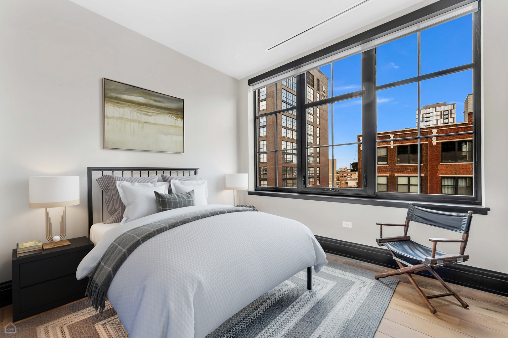 1109 West Washington Boulevard, Unit 6B Chicago, IL 60607 - Photo 30 of 40 a spacious bedroom with a bed and a large window