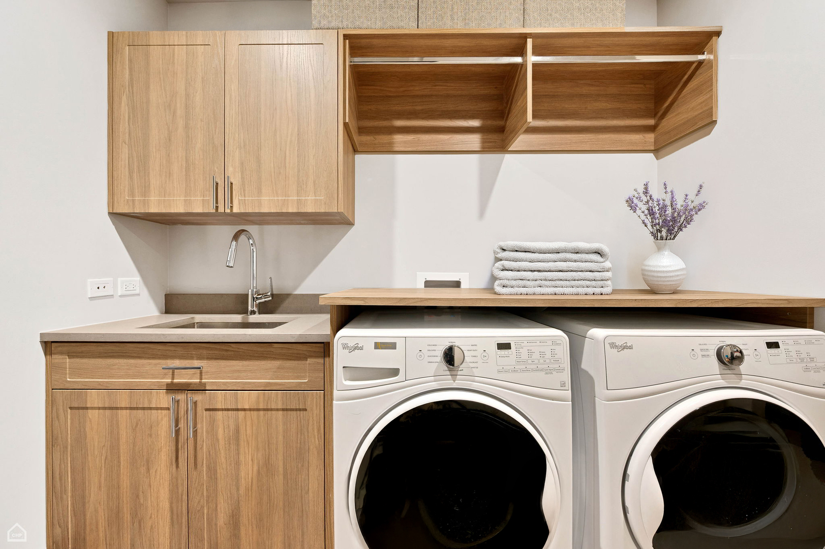 1109 West Washington Boulevard, Unit 6B Chicago, IL 60607 - Photo 37 of 40 a close view of a utility room with dryer and washer