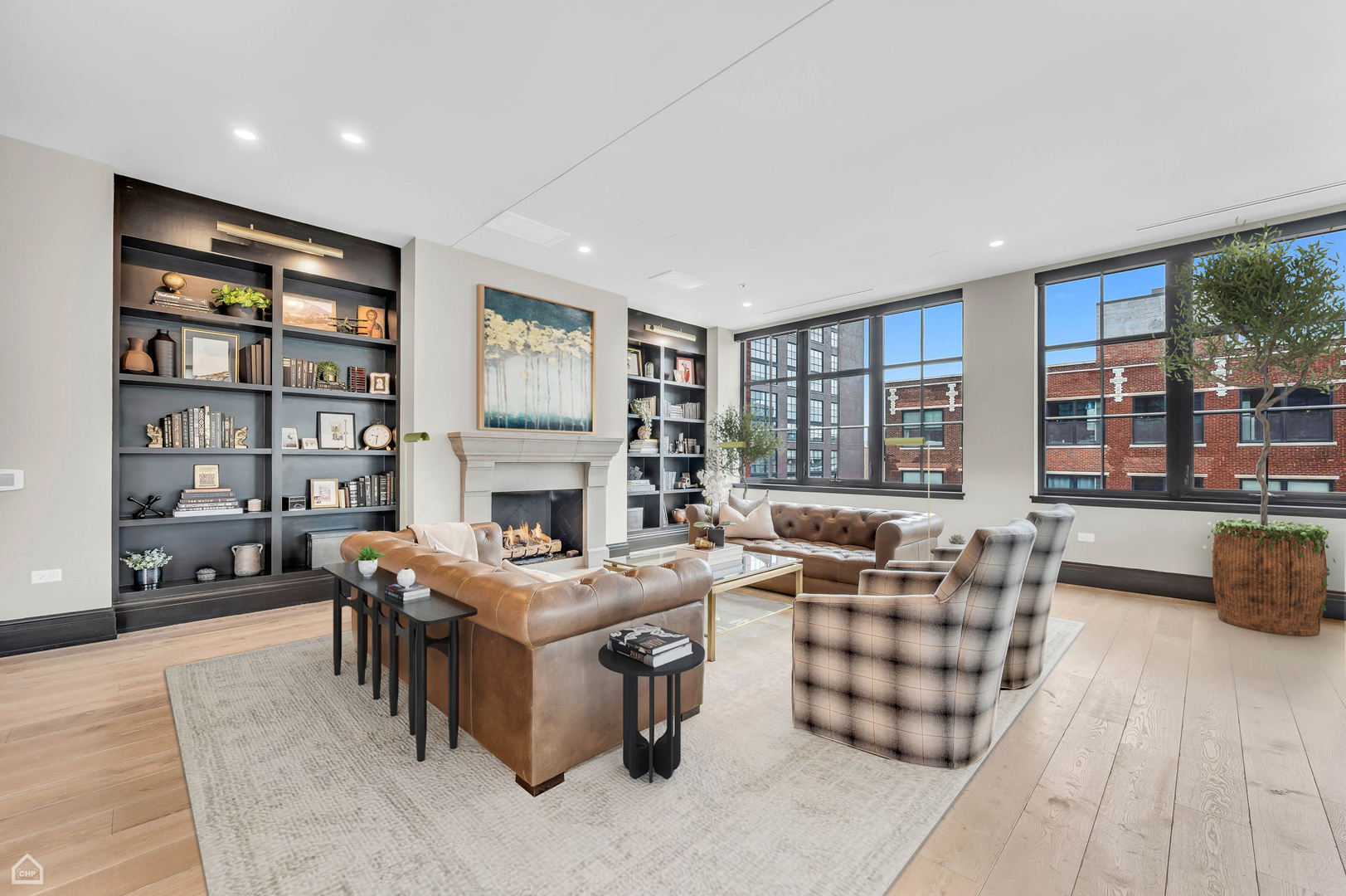 1109 West Washington Boulevard, Unit 6B Chicago, IL 60607 - Photo 4 of 40 a living room with fireplace furniture and a book shelf