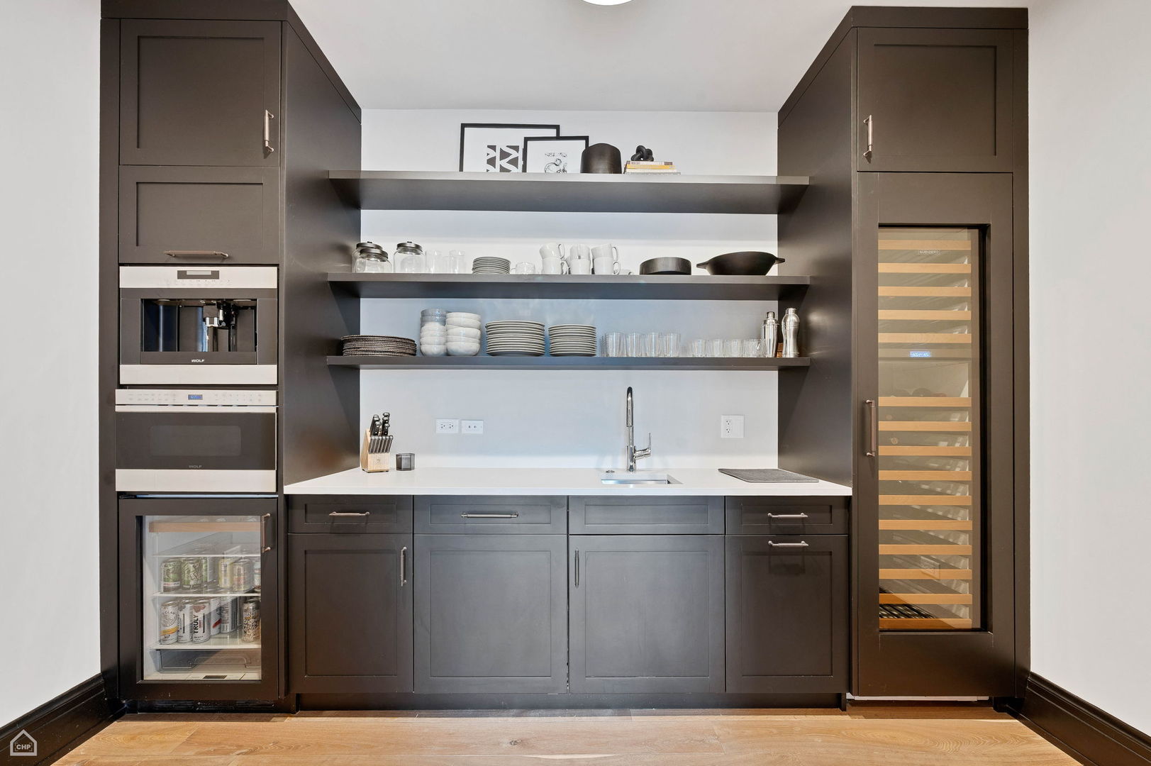 1109 West Washington Boulevard, Unit 6B Chicago, IL 60607 - Photo 10 of 40 a kitchen with stainless steel appliances granite countertop a sink and cabinets