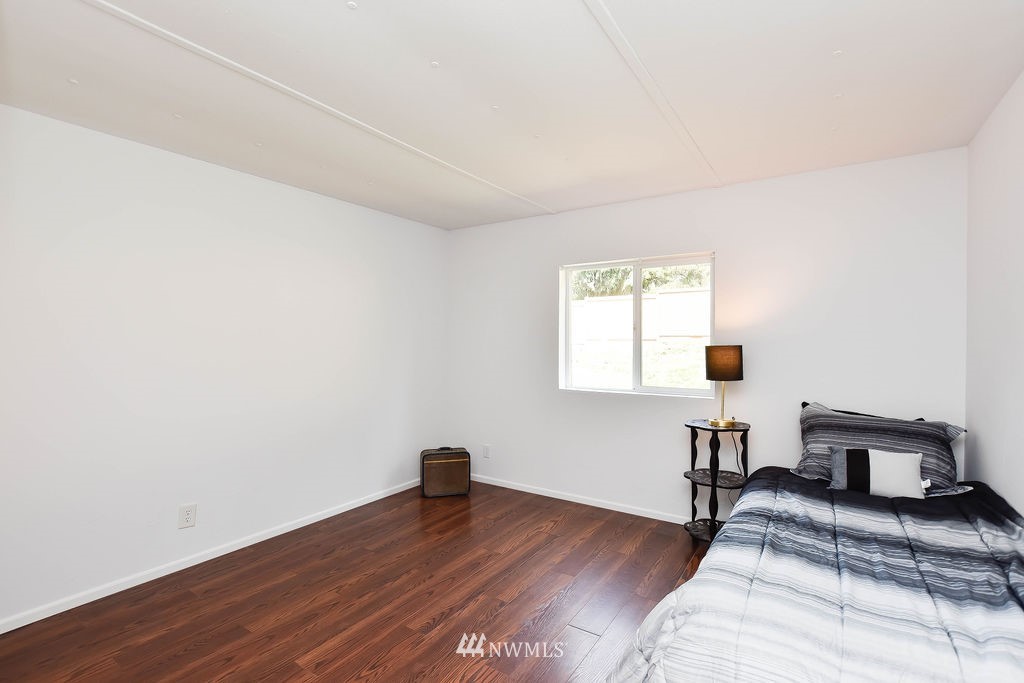 17920 Trombley Road Snohomish, WA 98290 - Photo 16 of 36 a bedroom with a bed and a window